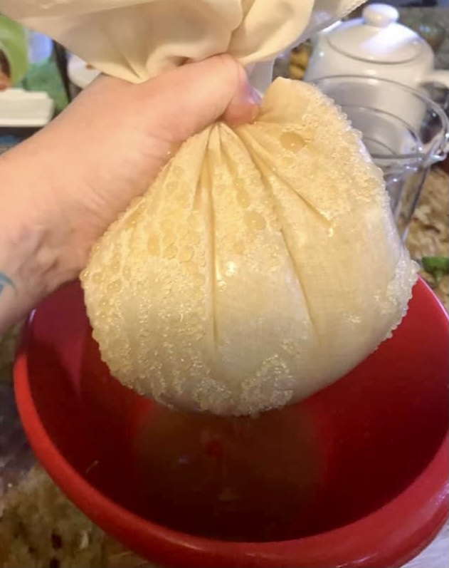 Hand PressIng Apple Pomace (photo by Yvonne Hicks)